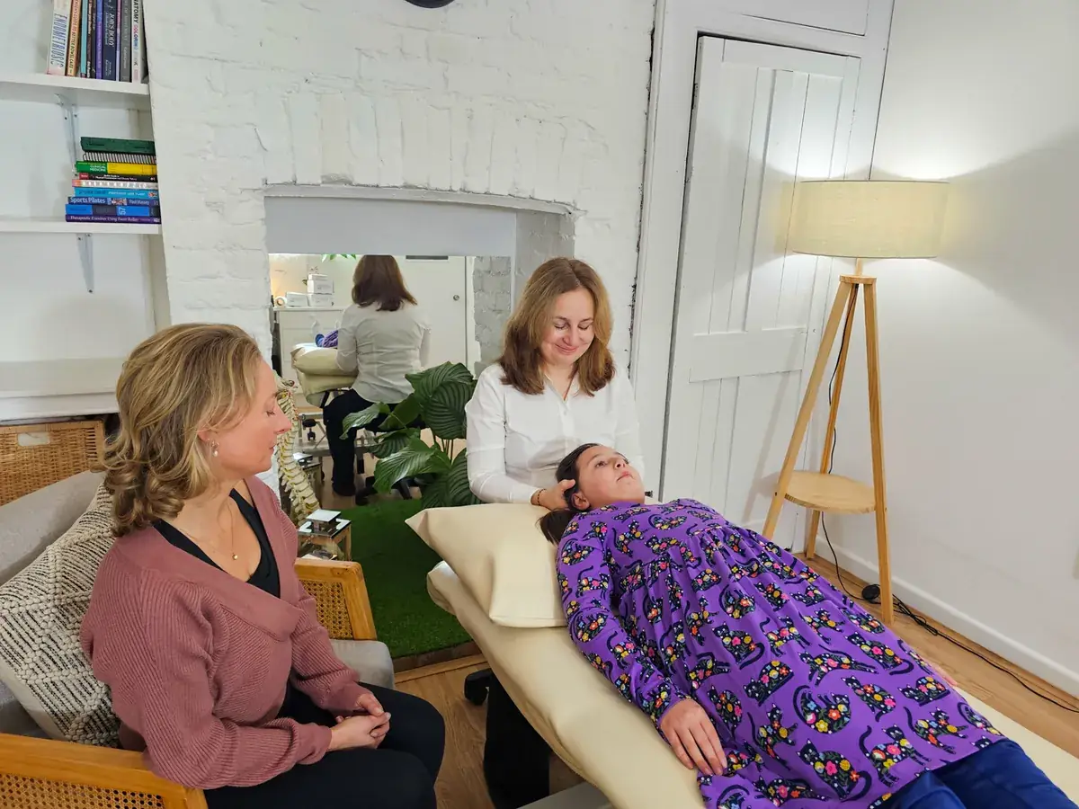 A child lying comfortably during a gentle osteopathy appointment